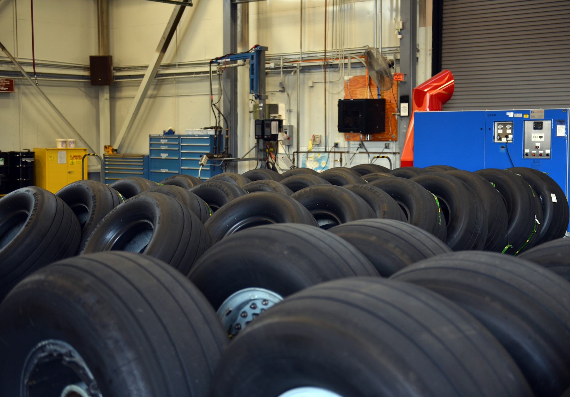 C-17 Globemaster III aircraft tires fill the floor at the 62nd Maintenance Squadron’s wheel and tire shop Aug. 1, 2013 at Joint Base Lewis-McChord.  With their new wheel and tire machine, the four-man wheel and tire shop has the capability to complete maintenance inspections on 12-tire assemblies in a four-hour period with a monthly inspection average of 125 units. (U.S. Air Force photo/Staff Sgt. Jason Truskowski)