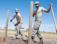Staff Sgts. Raymond Zgoda (left) and Paul Terlop, 28th Civil Engineer Squadron heavy equipment and pavement technicians, level dirt and gravel during construction of the new archery range on Ellsworth Air Force Base, S.D., July 26, 2013. ¬¬¬The new range, operated by Outdoor Recreation, is located near the 28th Security Forces Squadron Combat Arms Training and Maintenance facility and features multiple targets at 10, 20 and 30 meters. For more information, contact Outdoor Recreation at (605) 385-2997. (U.S. Air Force photo by Senior Airman Kate Maurer/Released)