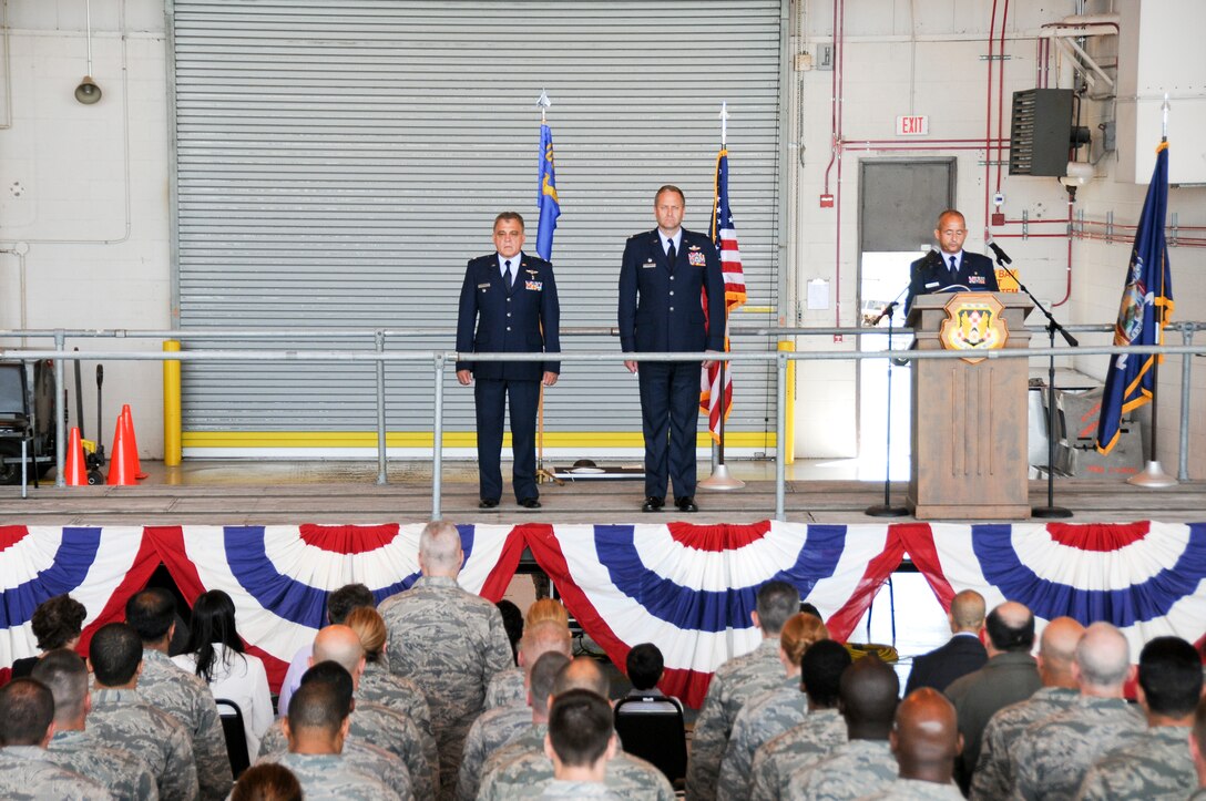 U.S. Air Force Col Joseph E. Deluca, outgoing commander, stands next to Wing Commander Col Timothy J. LaBarge at a 105th Medical Group, New York Air National Guard Change of Command Ceremony taking place inside a 105th Airlift Wing hangar, Stewart ANGB, Newburgh, N.Y., August 4, 2013.(U.S. Air National Guard photo by Tech. Sgt. Michael OHalloran/Released)