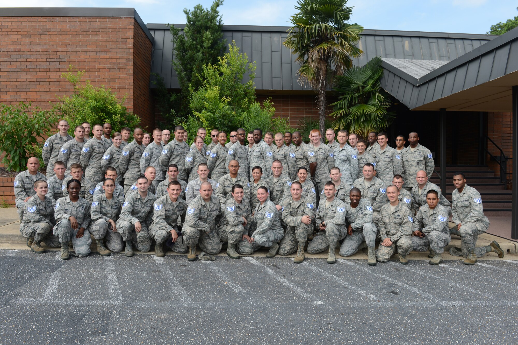 Team Shaw staff sergeant selects pose for a group photo at Shaw Air Force Base, S.C., Aug. 2, 2013. (U.S. Air Force photo by Airman 1st Class Krystal Jeffers/Released)