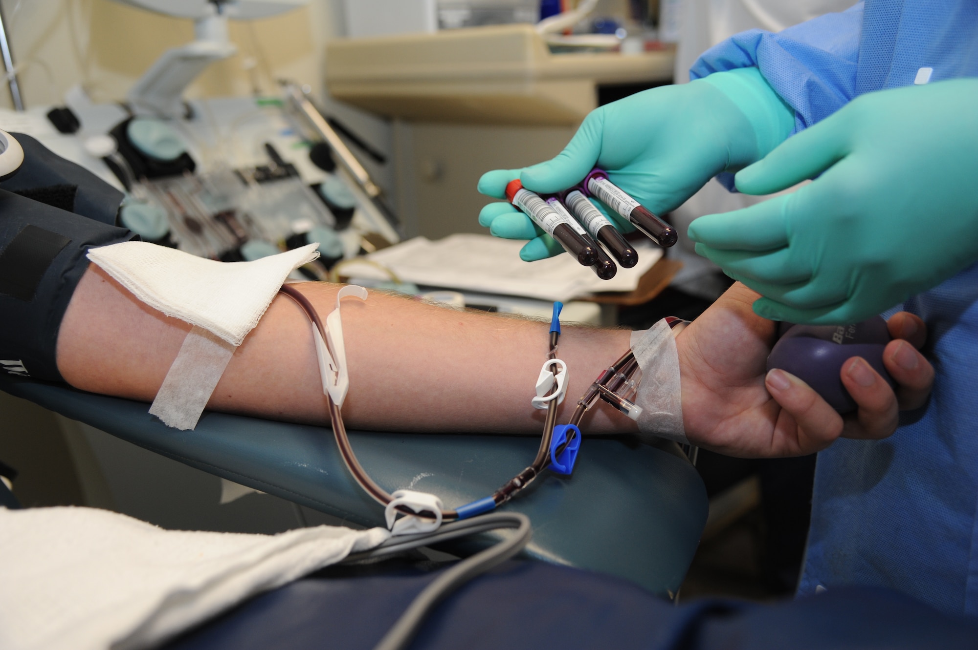 A Keesler Airman donates apheresis platelets Aug. 6, 2013, at the Keesler Medical Center, Keesler Air Force Base, Miss.  Platelets may be required daily by leukemia patients who do not produce enough for themselves.  (U.S. Air Force photo by Kemberly Groue)