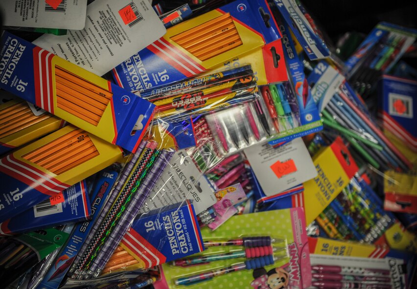 Writing utensils, markers, backpacks and many more items donated through the Operation Homefront program fill tubs for school-aged children at Moody Air Force Base, Ga., Aug. 5, 2013. The program received its donations from customers of businesses within the local area. (U.S. Air Force photo by Airman Alexis Grotz/Released)