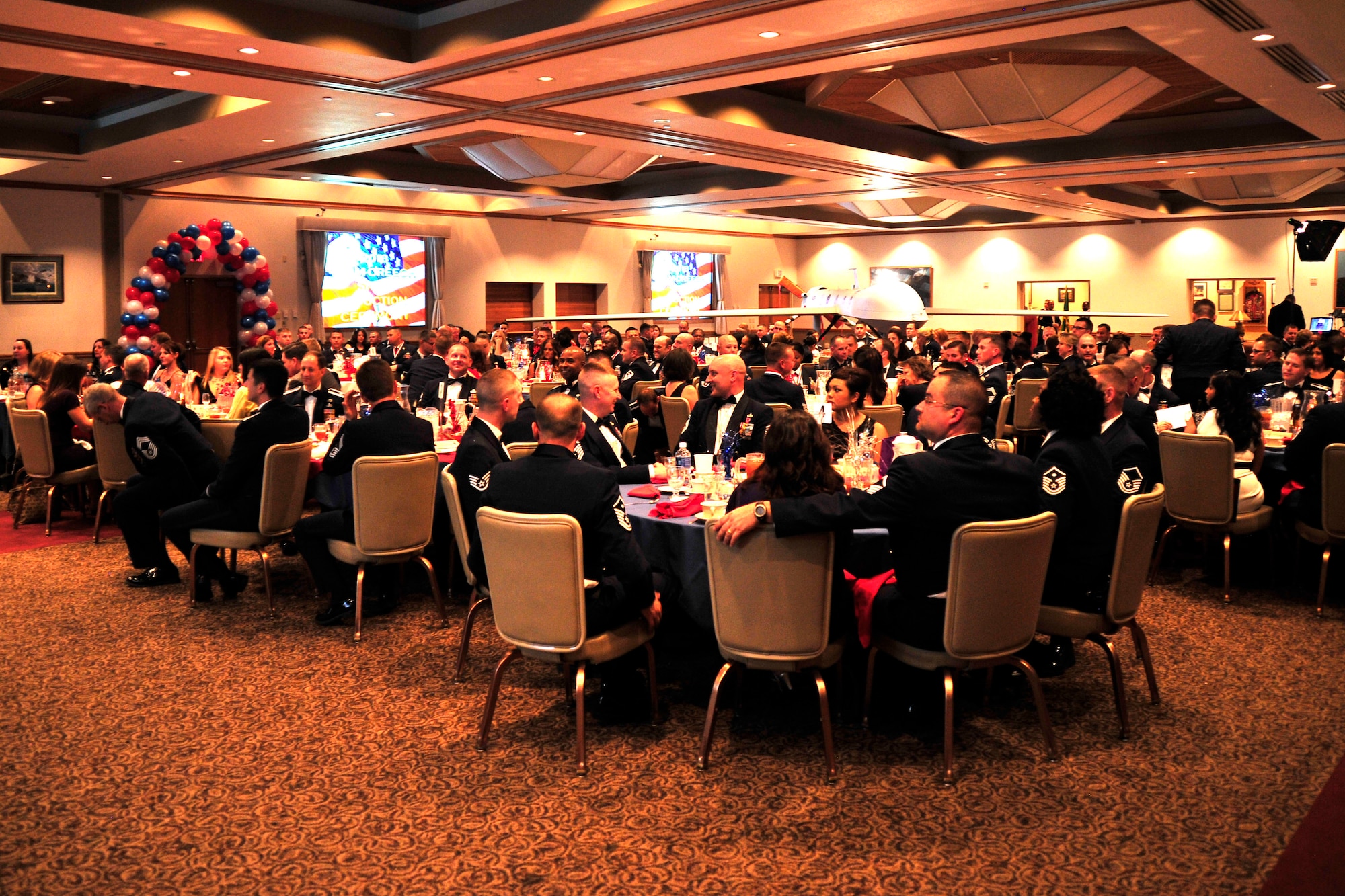 NELLIS AIR FORCE BASE, Nev. -- Attendees listen to various guest speakers during the Creech Air Force Base Senior Noncommissioned Officer Induction Ceremony Aug. 2, 2013.  This year’s speakers included an airman, NCO, SNCO and company grade officer, who discussed characteristics of effective SNCOs as the inductees prepare to transition from the NCO tier to the senior NCO tier. (U.S. Air Force photo by 1st Lt. S.S./Released)