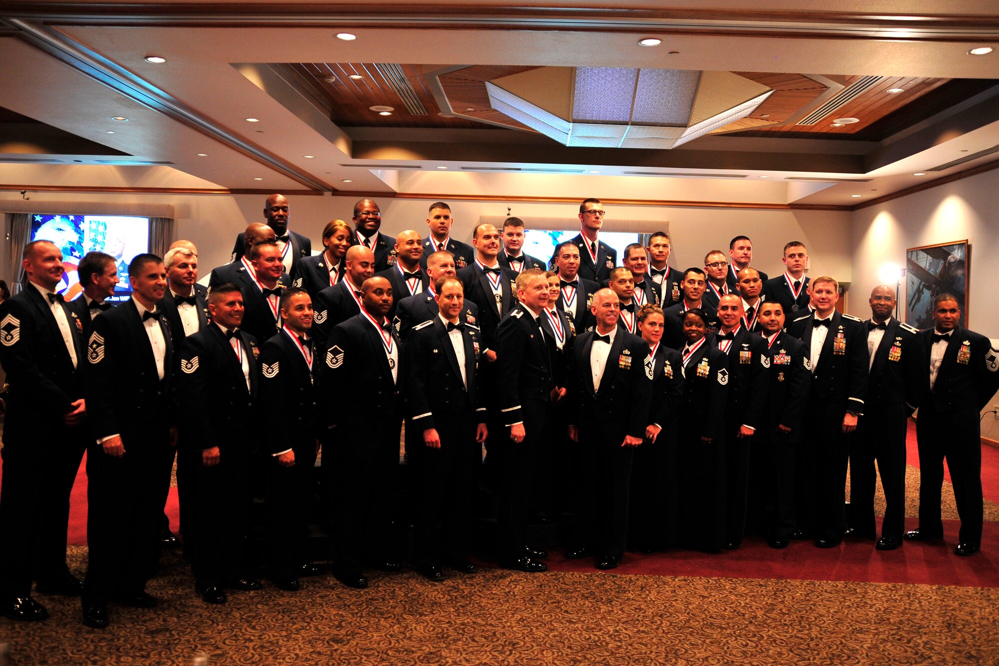 NELLIS AIR FORCE BASE, Nev. -- Creech Air Force Base leadership and senior noncommissioned officer inductees pose for a group photo before the Creech AFB SNCO Induction Ceremony Aug. 2, 2013.  Thirty-four technical sergeants assigned to the 432nd Wing and 799th Air Base Group were selected for promotion to the rank of master sergeant.  (U.S. Air Force photo by 1st Lt. S.S./Released)