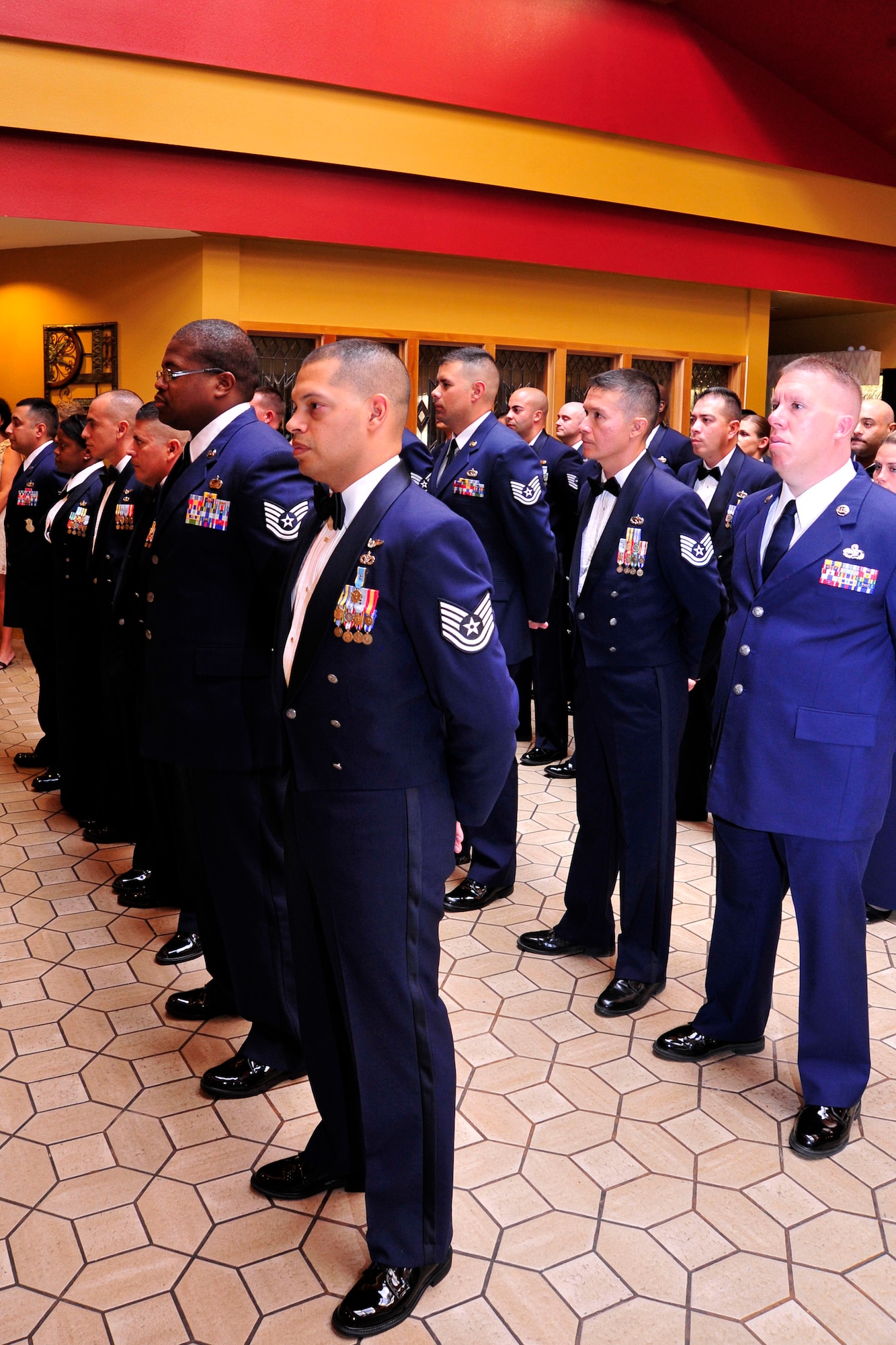 NELLIS AIR FORCE BASE, Nev. -- 432nd Wing and 799th Air Base Group senior noncommissioned officer inductees stand in formation prior to the SNCO medallion ceremony Aug. 2, 2013.  Creech Air Force Base commanders and chief master sergeants presented the 34 inductees with medallions to congratulate them for achieving the rank of master sergeant.  (U.S. Air Force photo by 1st Lt. S.S./Released)