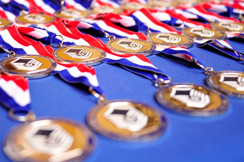 NELLIS AIR FORCE BASE, Nev. -- Medallions emblazoned with the USAF’s master sergeant chevron are displayed before the Creech Air Force Base Senior Noncommissioned Officer Induction Ceremony Aug. 2, 2013.  The SNCO induction ceremony takes place annually to recognize Airmen for achieving the Air Force’s top enlisted tier. (U.S. Air Force photo by 1st Lt. S.S./Released)