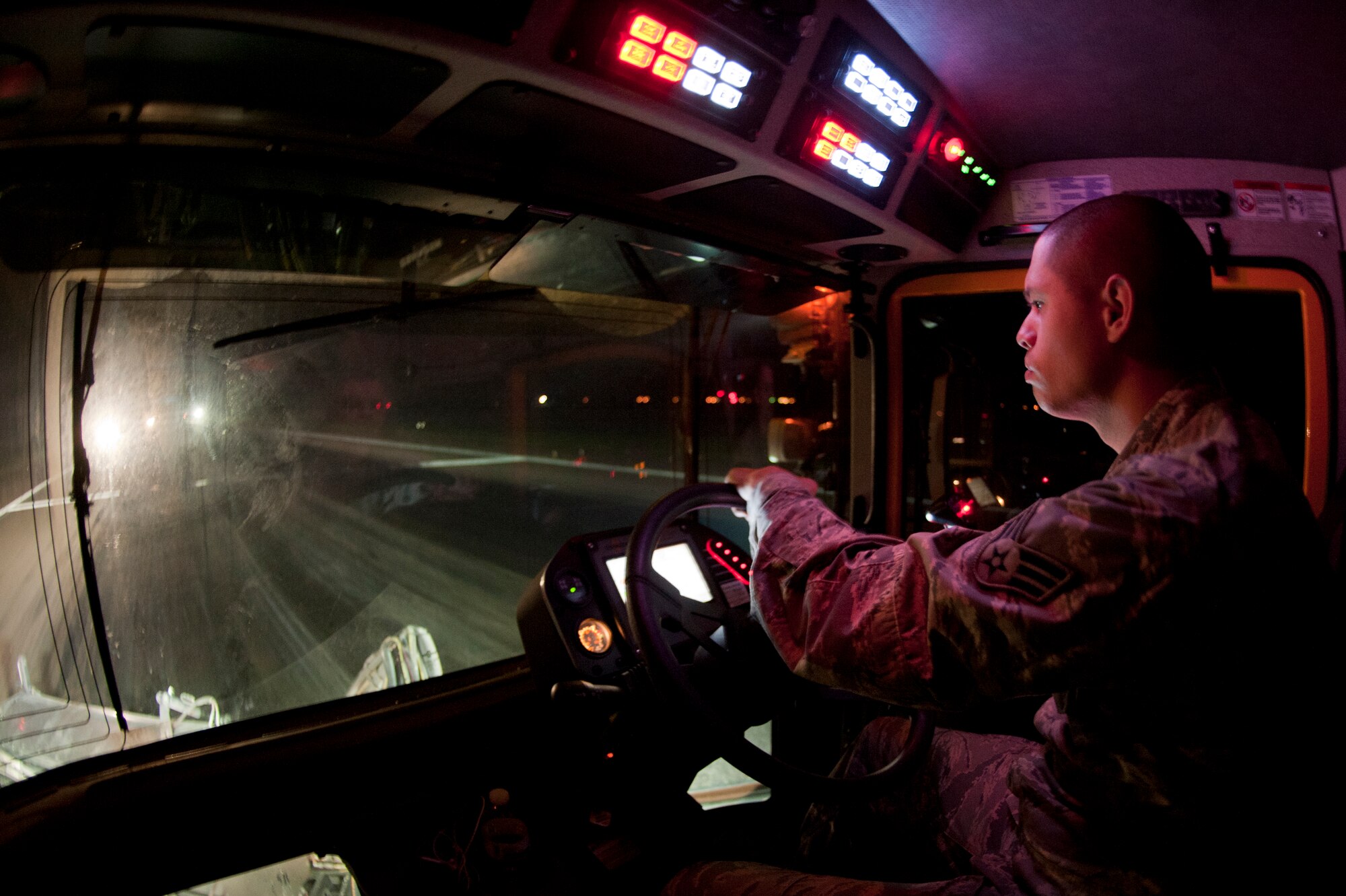 ALTUS AIR FORCE BASE, Okla. – U.S. Air Force Senior Airman Michael McCoy, 97th Civil Engineer Squadron pavement and heavy equipment operator, drives an Oshkosh street brush down the flighline during a rubber removal process, Aug. 2. The brush is used to pull up rubber particles left behind by landing aircraft and ensures future landings will have the maximum amount of traction when touching down. (U.S. Air Force photo by Senior Airman Dillon Davis/Released)