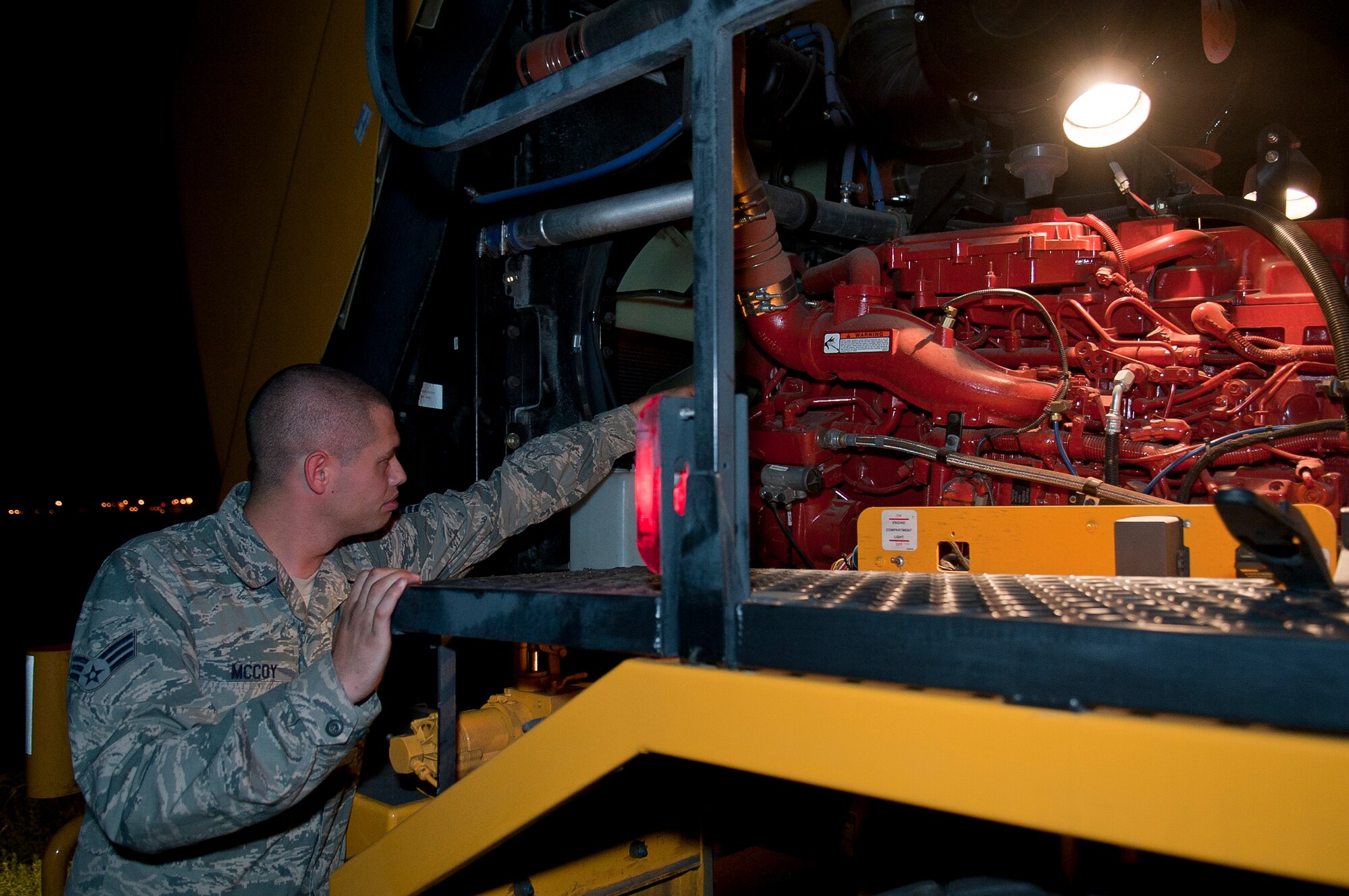 ALTUS AIR FORCE BASE, Okla. – U.S. Air Force Senior Airman Michael McCoy, 97th Civil Engineer Squadron pavement and heavy equipment operator, checks the oil levels of an Oshkosh street brush before a rubber removal on the flightline here, Aug. 2. Inspecting the equipment before use is important to ensuring the equipment functions properly and will perform the task at hand. (U.S. Air Force photo by Senior Airman Dillon Davis/Released)