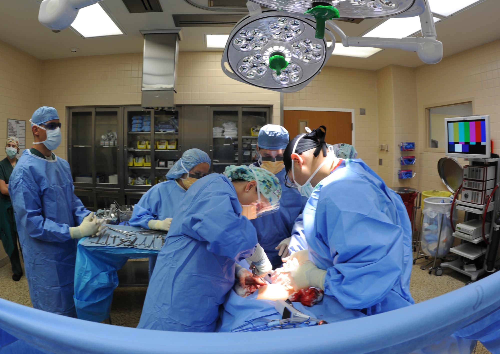 A surgical team works together to perform an operation, July 29, 2013, at Mountain Home Air Force Base, Idaho. Patient safety is the number one priority for the 366th Surgical Operations Squadron. (U.S. Air Force photo by Senior Airman Benjamin Sutton/Released)
