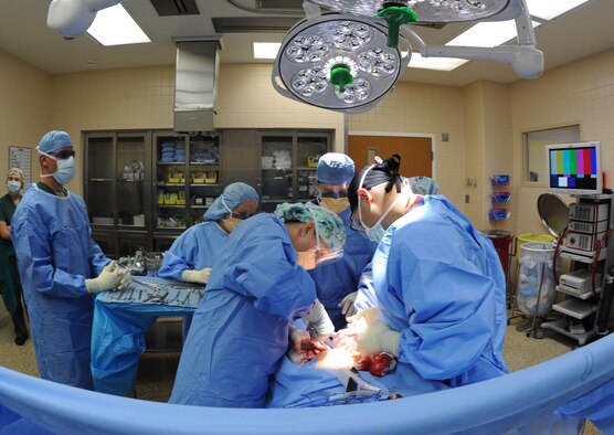 A surgical team works together to perform an operation, July 29, 2013, at Mountain Home Air Force Base, Idaho. Patient safety is the number one priority for the 366th Surgical Operations Squadron. (U.S. Air Force photo by Senior Airman Benjamin Sutton/Released)

