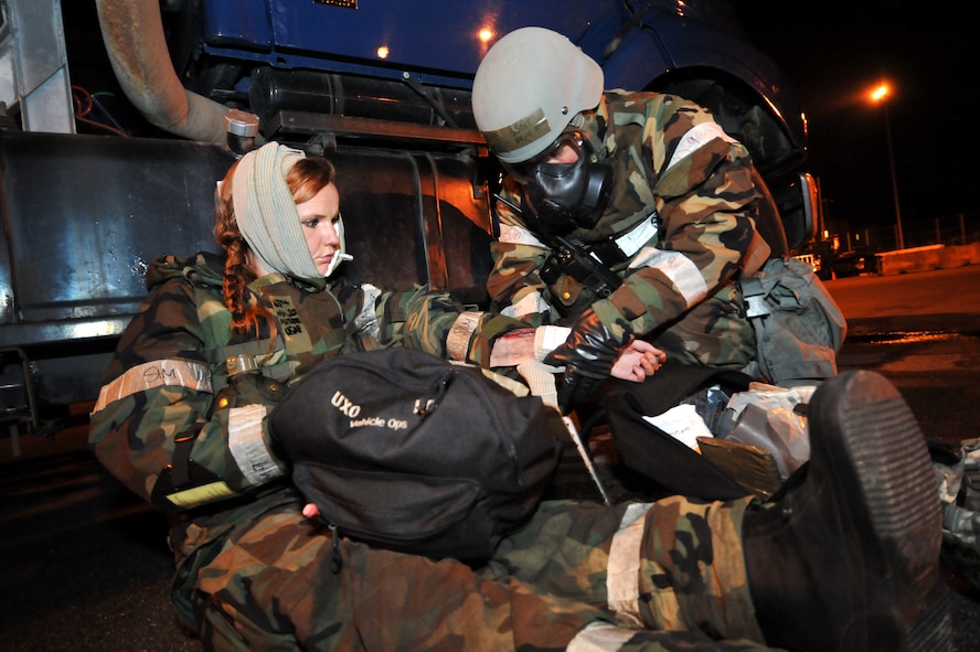 Staff Sgt. Derrall Peach Jr., 51st Logistics Readiness Squadron assistant dispatch support supervisor, places a bandage on a role player’s arm during a mass casualty exercise scenario during Operational Readiness Exercise Beverly Midnight 13-03 at Osan Air Base, Republic of Korea, August 6, 2013. Osan Airmen go through OREs to maintain proficiency for wartime conditions. (U.S. Air Force photo/Staff Sgt. Emerson Nuñez)