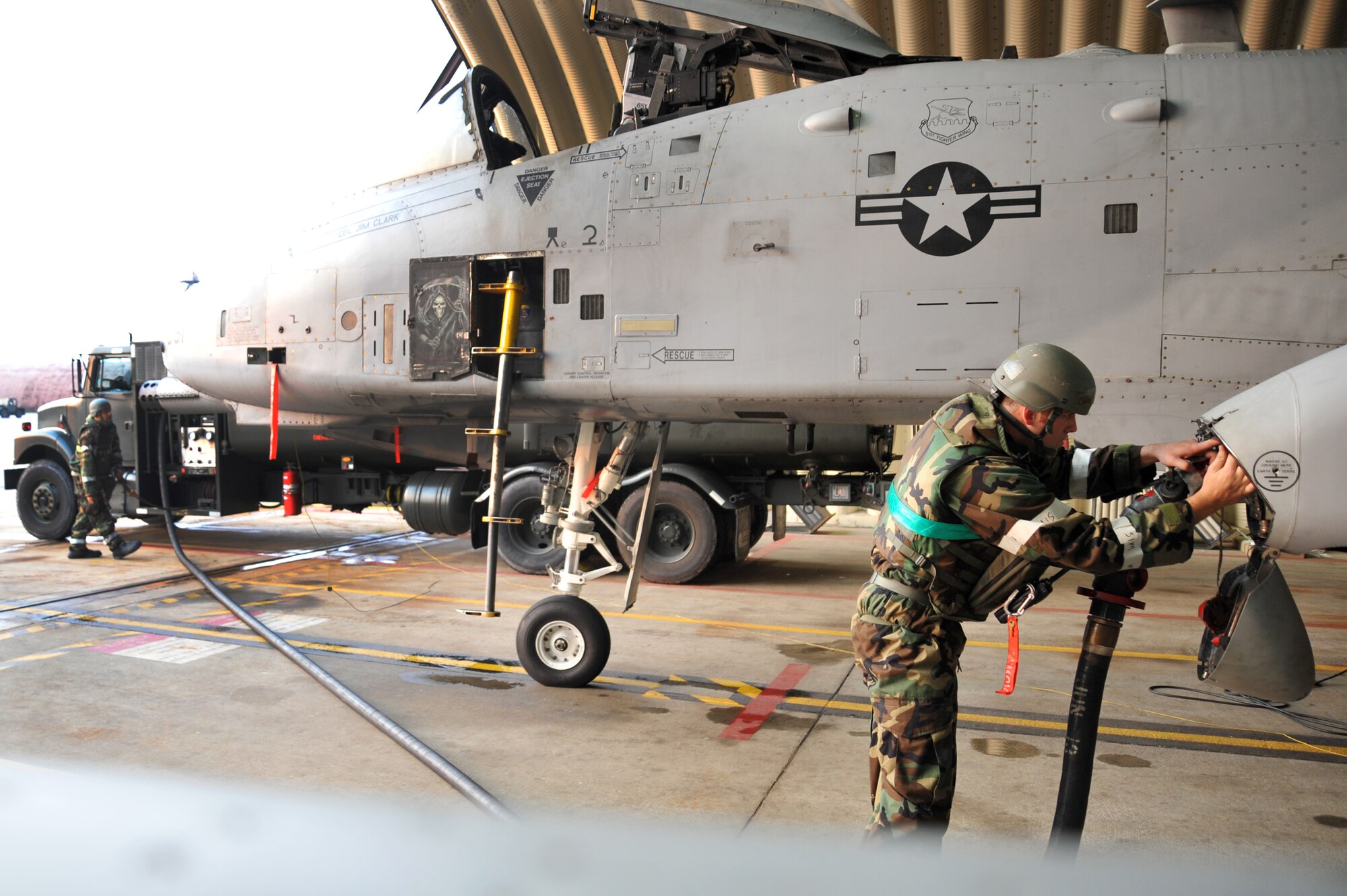 Staff Sgt. Caleb Parton, 51st Aircraft Maintenance Squadron crew chief, attaches a fuel hose to an A-10 Thunderbolt during Operational Readiness Exercise Beverly Midnight 13-03 at Osan Air Base, Republic of Korea, August 6, 2013. Osan Airmen are in the fourth simulated wartime contingency exercise executed in 2013 that will test the base's ability to defend and execute the mission in a heightened state of readiness. (U.S. Air Force photo/Staff Sgt. Emerson Nuñez)