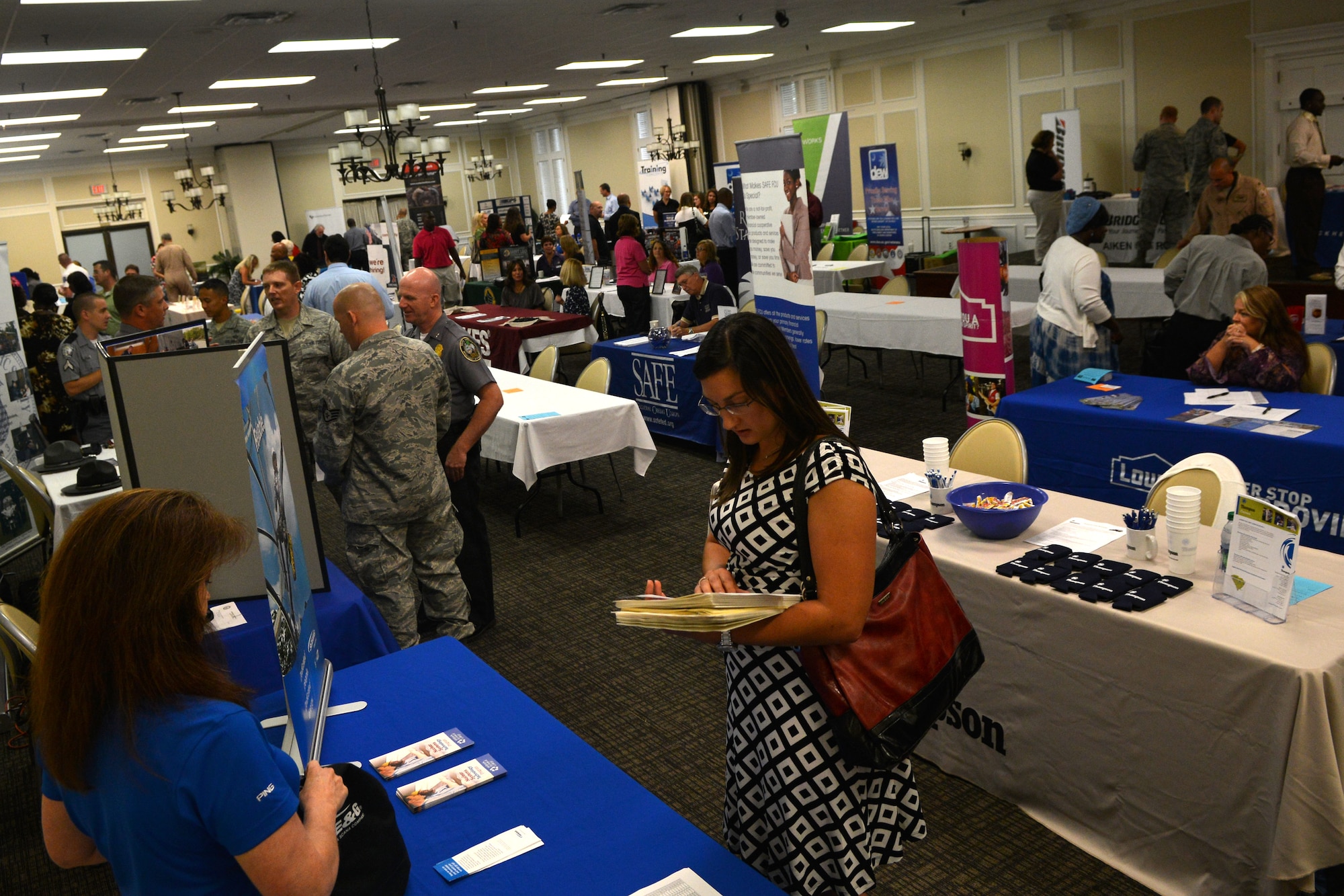 Military members, civilians, retirees and vendors gather together during a 20th Force Support Squadron job fair, Shaw Air Force Base, S.C., Aug. 2, 2013. Arriving with job positions and education opportunities, 36 vendors set up booths at the Carolina Skies Club and Conference Center on base. (U.S. Air Force photo by Airman 1st Class Ashley L. Gardner/Released)