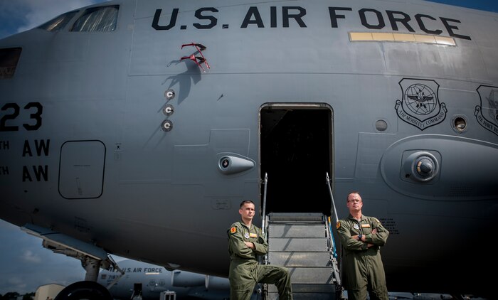 Capt. Paul Geunther, 16th Airlift Squadron C-17 pilot, and Master Sgt. Aaron Avery, 16th AS standards and evaluations superintendent, have 31 years of combined experience inside the C-17 Globemaster III. JB Charleston is scheduled to receive the final C-17 Sept. 12, 2013, as Boeing completes work on the U.S. Air Force’s last Globemaster. The first C-17 to enter the Air Force’s inventory arrived at Charleston Air Force Base in June 1993. The C-17 is capable of rapid strategic delivery of troops and all types of cargo to main operating bases or directly to forward bases in the deployment area. (U.S. Air Force photo / Airman 1st Class Tom Brading)
