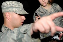 KUNSAN AIR BASE, Republic of Korea -- Senior Airman Dennis Petzold, 8th Civil Engineer Squadron exercise post-attack reconnaissance team lead, plots out the route for a sweep during an operational readiness exercise at Aug. 7, 2013. The exercise prepares Airmen for combat-related events by presenting scenarios they may not face every day.(U.S. Air Force photo by Senior Airman Armando A. Schwier-Morales/ Released)