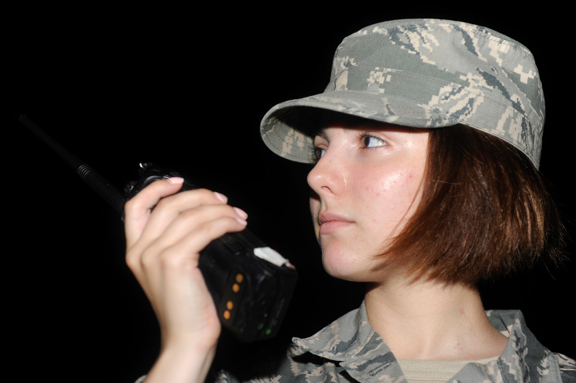 KUNSAN AIR BASE, Republic of Korea -- Airman 1st Class Marina Clark, 8th Civil Engineer Squadron exercise post-attack reconnaissance team member, radios after conducting an area sweep during an operational readiness exercise Aug. 7, 2013. During exercise Beverly Midnight 13-3, PAR teams ensure the base is able to continue normal operations in a timely manner. (U.S. Air Force photo by Senior Airman Armando A. Schwier-Morales/ Released)