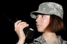 KUNSAN AIR BASE, Republic of Korea -- Airman 1st Class Marina Clark, 8th Civil Engineer Squadron exercise post-attack reconnaissance team member, radios after conducting an area sweep during an operational readiness exercise Aug. 7, 2013. During exercise Beverly Midnight 13-3, PAR teams ensure the base is able to continue normal operations in a timely manner. (U.S. Air Force photo by Senior Airman Armando A. Schwier-Morales/ Released)