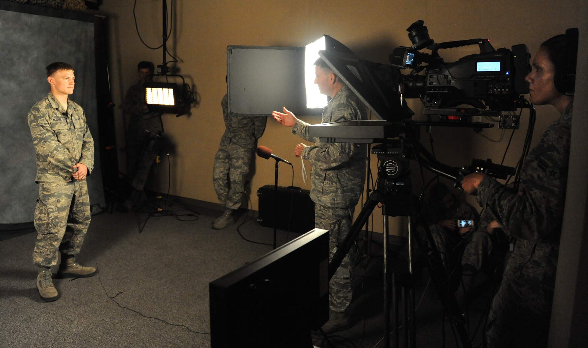 U.S. Air Force Academy cadet Carter McElhany practices a mock interview July 24, 2013 during the cadet’s tour of the 375th Air Mobility Wing Public Affairs office.  Twelve cadets toured different organizations on base from July 17 through Aug. 1 to see how they meet their mission requirements.  (U.S. Air Force photo by Staff Sgt. Maria Bowman)