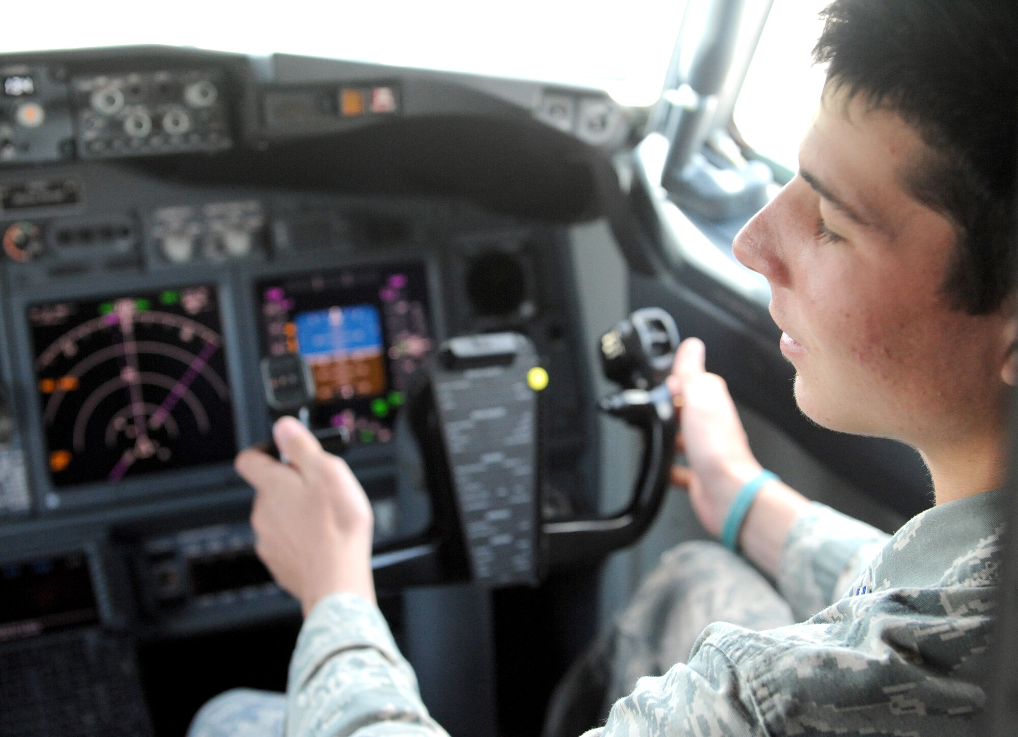U.S. Air Force Academy cadet Andrew Miller sits in the cock pit of USAF C-40C at Scott AFB July 23, 2013.  Miller is going into his junior year in August at the Academy and hopes to be a pilot when he is graduates.  (U.S. Air Force photo by Staff Sgt. Maria Bowman)