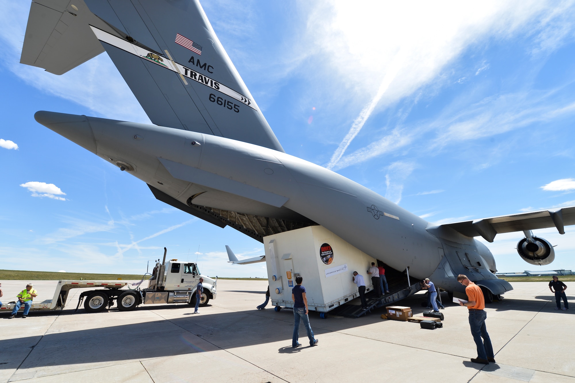 The Mars Atmosphere and Volatile Evolution Mission spacecraft is carefully loaded in the back of a C-17 Globemaster III Aug. 2, 2013, at Buckley Air Force Base, Colo. After the MAVEN launches in late 2013, it will orbit around the sun for a 10-month mission before heading to Mars. (U.S. Air Force photo by Staff Sgt. Paul Labbe/Released)