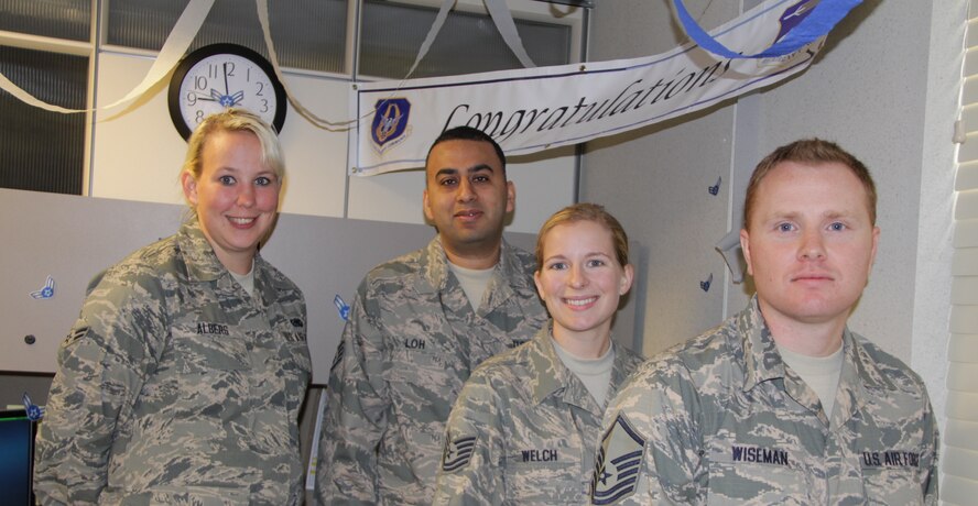 Four members of the 932nd Airlift Wing's Logistics Readiness Flight will be promoted during this month's unit training assembly at Scott Air Force Base, Ill.  Left to right: Airman 1st Class Ashley Albers, Staff Sgt. Taranjeet Loh, Tech Sgt. Geena Welch and Master Sgt. Darren Wiseman.  (U.S. Air Force photo/Staff Sgt. Meiko Schill)