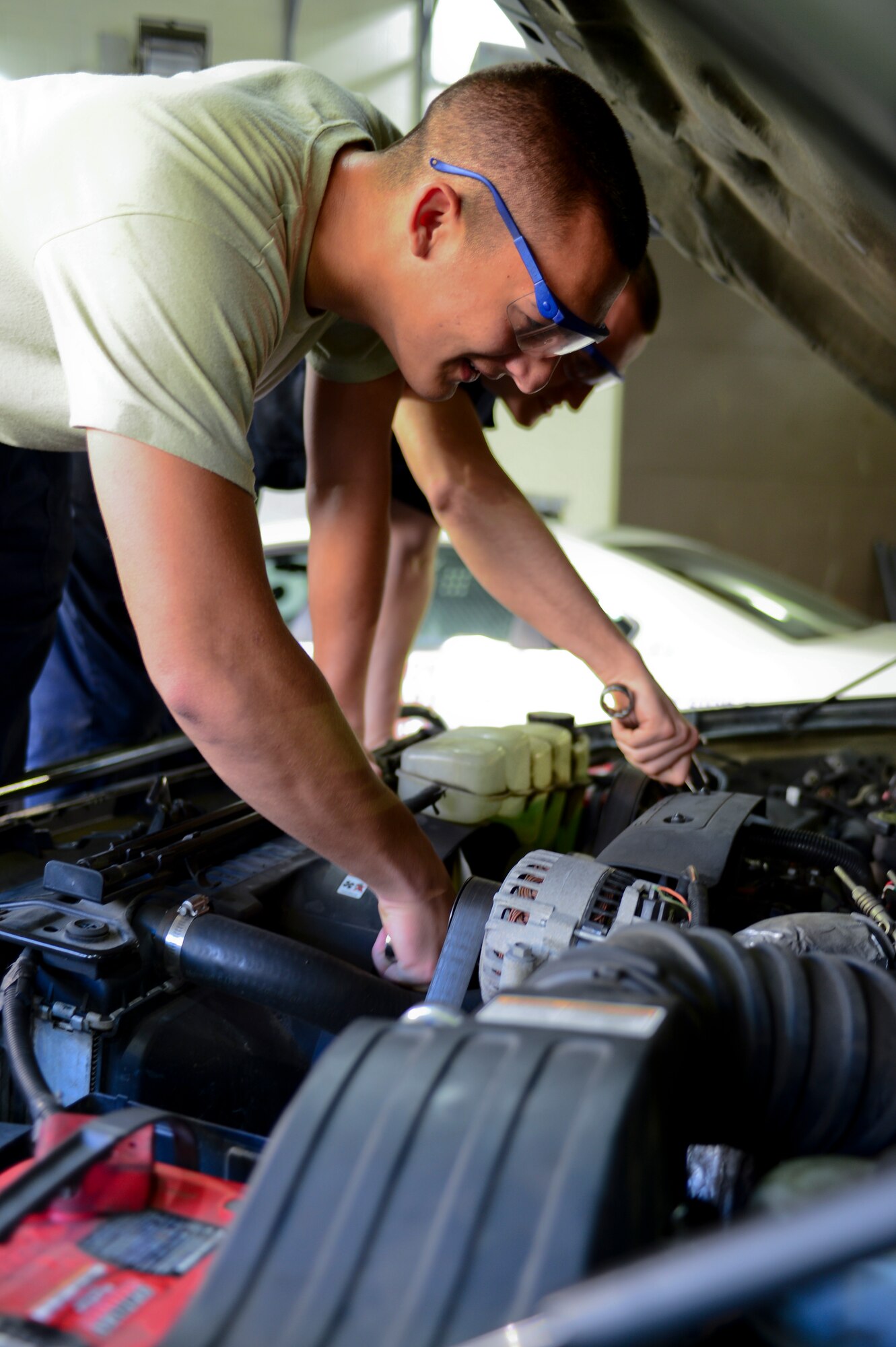 Airman 1st Class Harry Sopp, 48th Logistics Readiness Squadron vehicle maintainer, checks under the hood of a government vehicle during a Logistics Compliance Assessment Program inspection at Royal Air Force Lakenheath, England, August 6, 2013. The five-day inspection focuses on checklist compliance, quality verification inspections and personnel evaluations within different units of LRS and MXG. (U.S. Air Force photo by Airman 1st Class Dana J. Butler/Released)