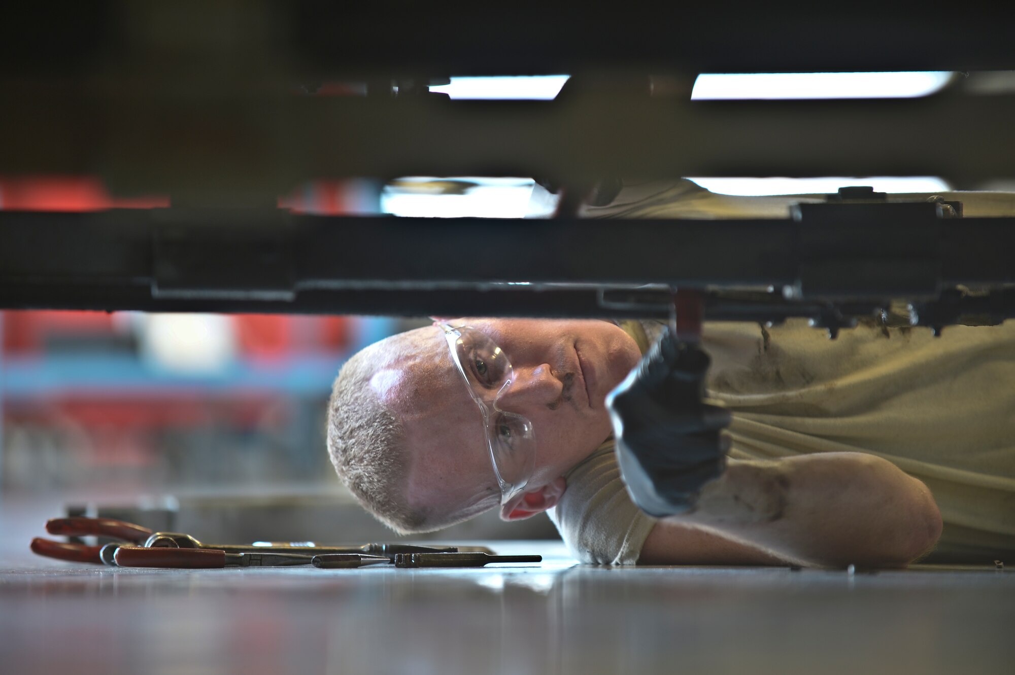 Airman 1st Class Michael Watkins, 6th Maintenance Squadron aerospace ground equipment technician, disassembles a broken Hobart power unit tow-bar at MacDill Air Force Base, Fla. on Aug 5, 2013. The 6th MXS AGE shop is in charge of more than 290 pieces of maintenance and flight operations critical equipment. (U.S. Air Force photo by Staff Sgt. Brandon Shapiro) 
