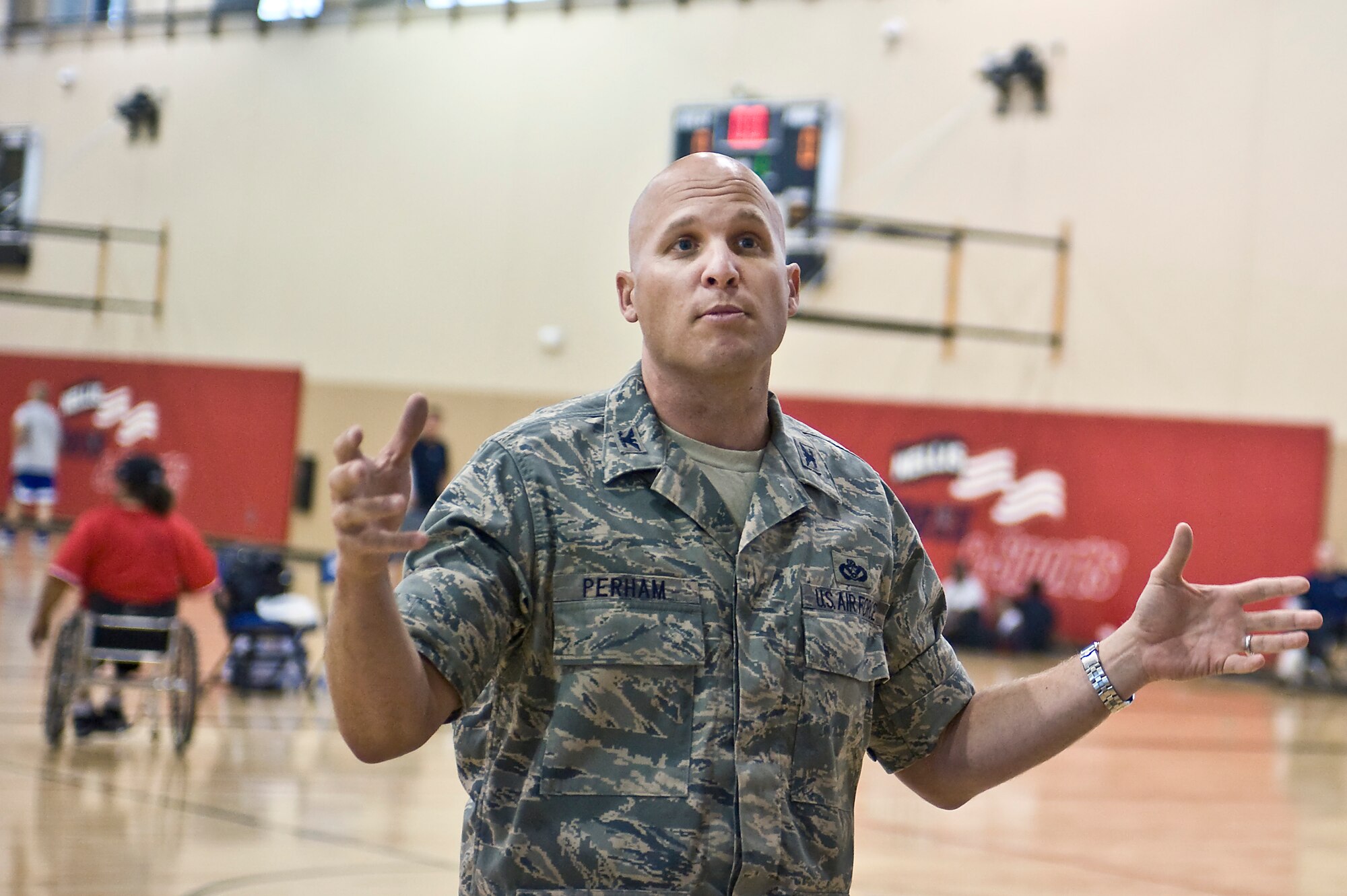 Col. Charles Perham, 99th Mission Support Group commander, provides closing remarks during the closing ceremony of the Air Force Wounded Warriors Adaptive Sports Camp at the Warrior Fitness Center Aug. 1, 2013, at Nellis Air Force Base, Nev. The sports camp was a three day event where wounded warriors pick sports to learn and practice, and then compete with fellow wounded warriors. (U.S. Air Force photo by Senior Airman Matthew Lancaster)