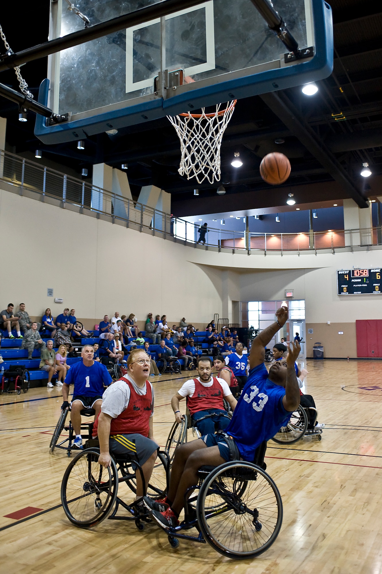 Air Force wounded warriors play wheelchair basketball against the Las Vegas Paralympic team during the Air Force Wounded Warrior Adaptive Sports Camp at the Warrior Fitness Center Aug. 1, 2013, at Nellis Air Force Base, Nev. Participants of this event include active-duty, retired and medically discharged wounded warriors. (U.S. Air Force photo by Senior Airman Matthew Lancaster)