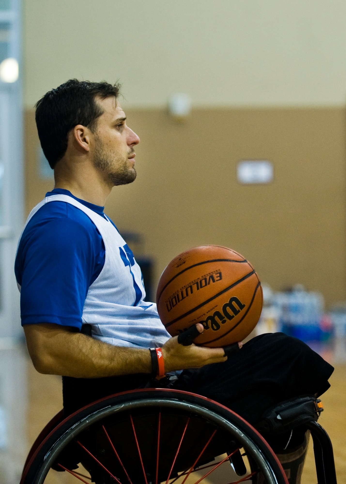 Thomas Martineau, a wounded warrior, participates in the Air Force Wounded Warrior Adaptive Sports Camp at the Warrior Fitness Center July 31, 2013, at Nellis Air Force Base, Nev.  The intended effect of the adaptive sports camp was to introduce the wounded warriors to adaptive sports such as sit volleyball and wheelchair basketball during the early stages of their recovery. According to the Wounded Warriors website, the program helps injured service members gain confidence and independence while adapting to life after injury. (U.S. Air Force Photo by Airman 1st Class Jason Couillard)