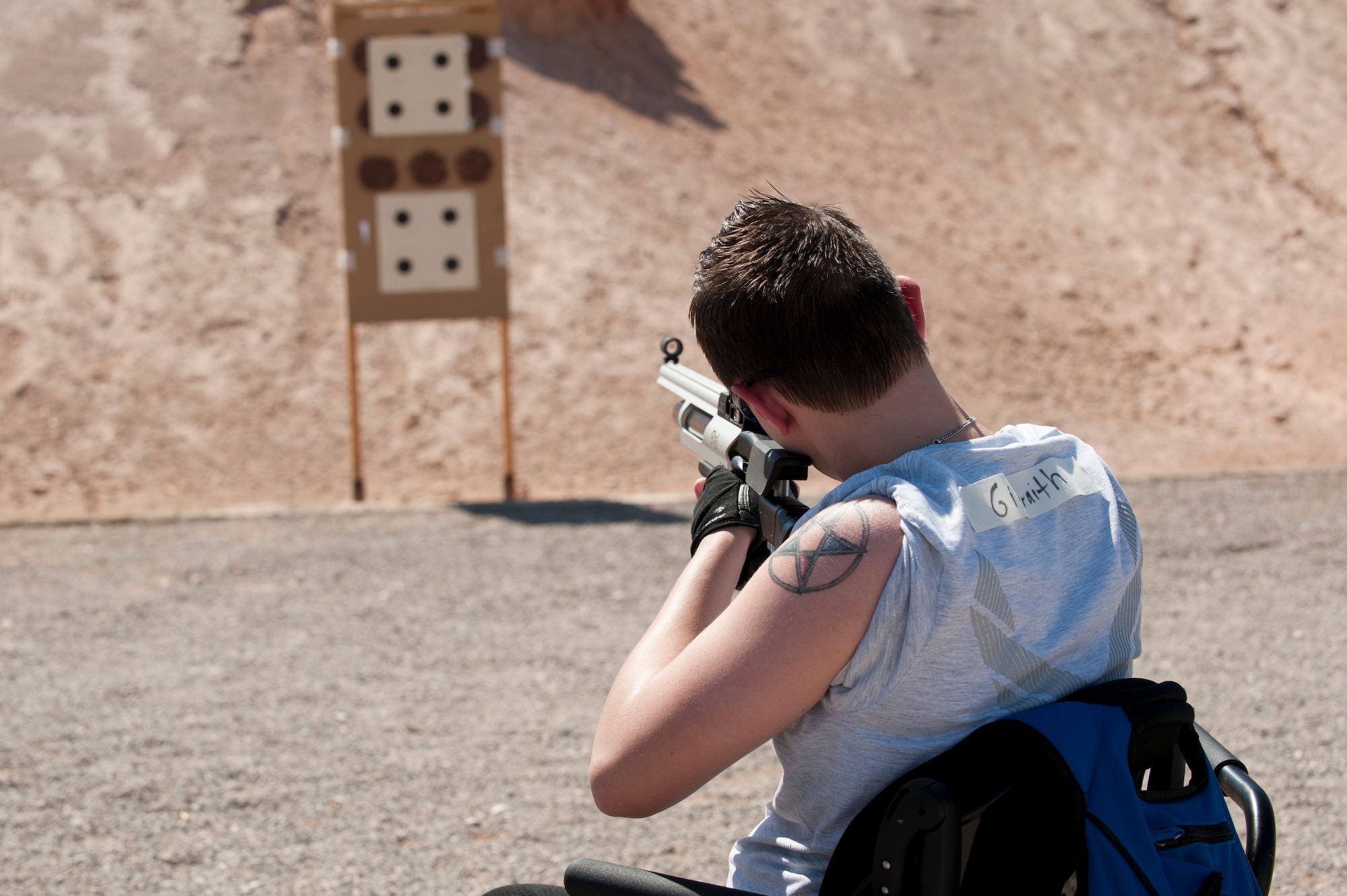 Haley Gilbraith, 315th Training Squadron imagery analyst  out of Goodfellow Air Force Base, Texas, aims her airsoft rifle during the Air Force Wounded Warrior Adaptive Sports Camp July 31, 2013, at Nellis Air Force Base, Nev. Wounded warriors from across the country came to Nellis AFB to participate in sports clinics such as wheelchair basketball, swimming and sit volleyball. (U.S. Air Force photo by Caitlin Kenney)