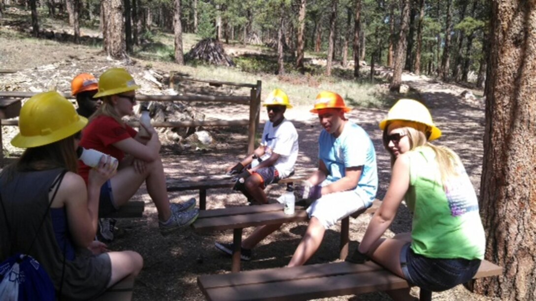 COLORADO SPRINGS, Colo. – Teens from the Peterson Keystone Club take a break while volunteering at the Florissant Fossil Beds National Park July 22 and 23. Nine youths and two adults from the teen program spent the weekend painting, building trails, clearing drainage, removing weeds, building benches and more at the park. For information about the teen program on Peterson, call LaTanya McCray at 556-7220. (Courtesy photo)