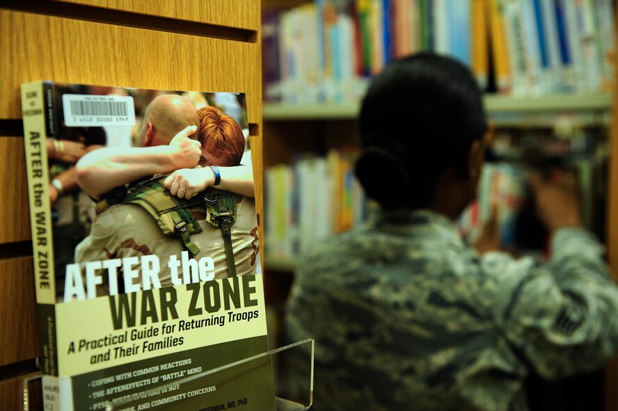Staff Sgt. Diane Flowers, 20th Fighter  Wing library aide, files books away on shelves at the McElveen Resource Center (library) at Shaw Air Force Base, S.C., July 31, 2013. Due to financial cutbacks Department of Defense wide, active-duty services members stepped in to accomplish tasks and duties traditionally filled by contractors or civilians; library aide is one such job. (U.S. Air Force photo by Airman 1st Class Daniel Blackwell/Released)