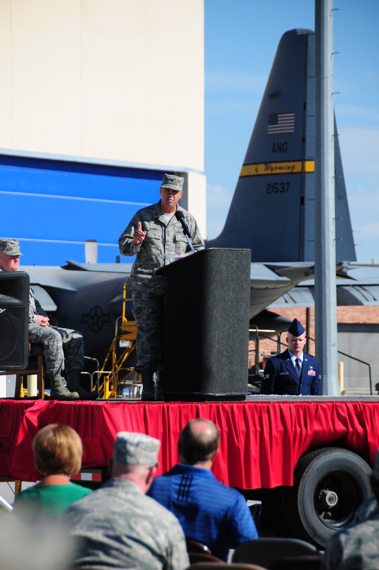 Col. Michael R. Taheri, 153rd Airlift Wing commander, addresses a gathered audience for the 153rd Mission Support Group change of command ceremony Aug. 4, 2013 at the Wyoming Air National Guard Base, Cheyenne, Wyo. Col. Shelley R. Campbell assumed command after serving as the chief of the joint staff for the Wyoming Air National Guard.  (U.S. Air National Guard photo by Capt. Rusty Ridley)