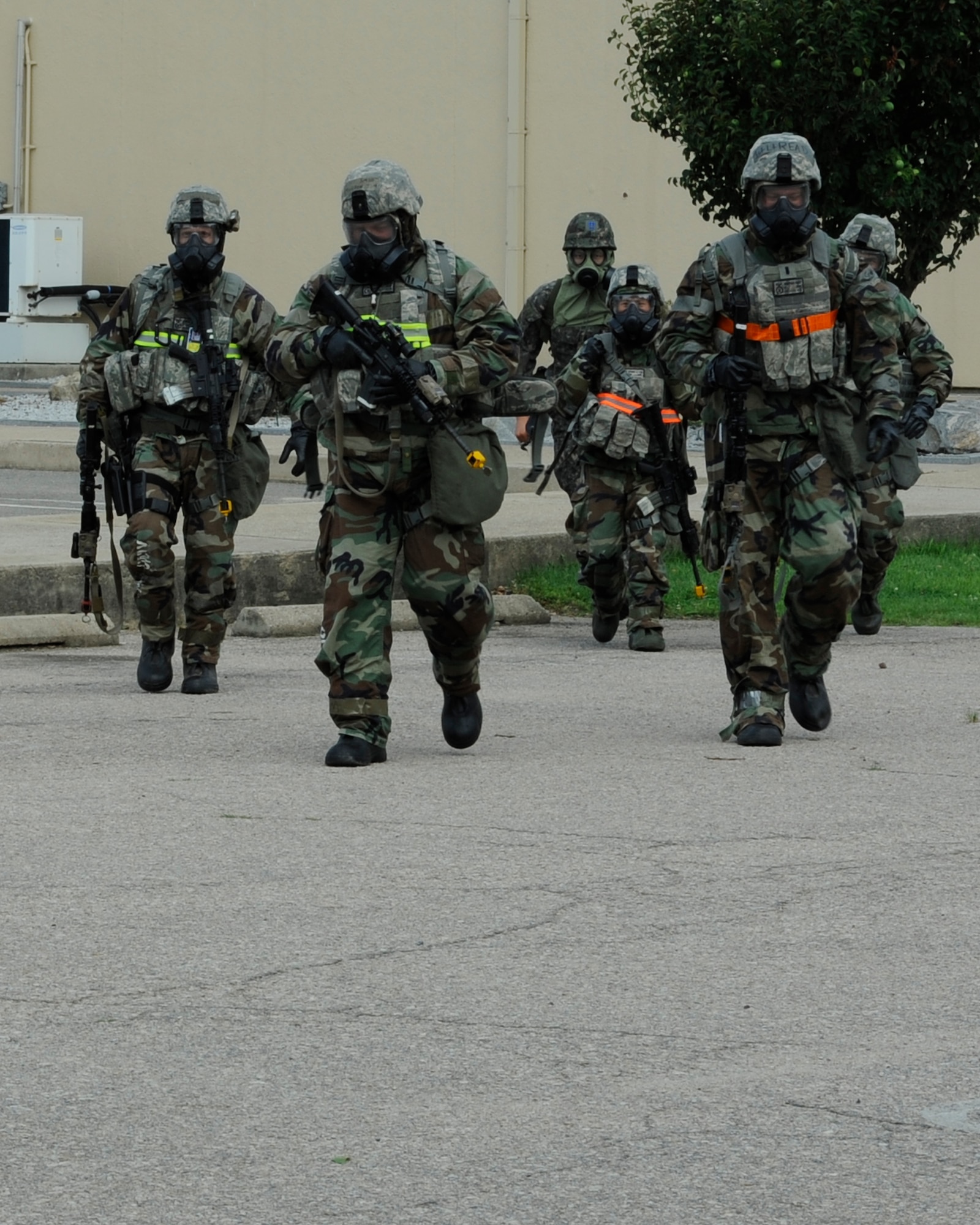 KUNSAN AIR BASE, Republic of Korea -- U.S. and Republic of Korea air force security personnel evacuate thier facility after a simulated missile attack during exercise Beverly Midnight 13-3, Aug. 6, 2013. The scenario challenged the members’ ability to relocate to an alternate location and continue the mission. (U.S. Air Force photo by Staff Sgt. Tong Duong/Released)
