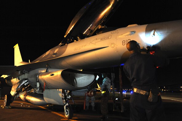 U.S. Air Force Staff Sgt. William Wilkins, 14th Aircraft Maintenance Unit crew chief, performs post-flight checks on an F-16 Fighting Falcon at Misawa Air Base, Japan, Aug. 1, 2013. Before and after each flight, crew chiefs perform inspections to ensure each jet is mission-ready. (U.S. Air Force photo by Senior Airman Derek VanHorn)