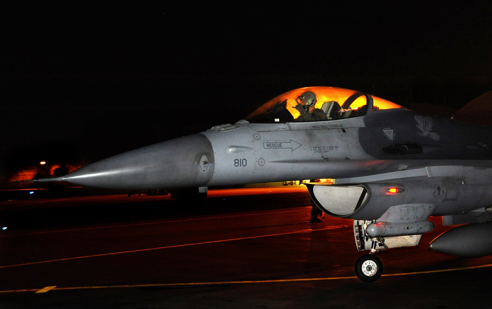 U.S. Air Force Capt. Matthew Kimmel, 14th Fighter Squadron, parks an F-16 Fighting Falcon on the flight line after completing a night flying mission over Misawa Air Base, Japan, Aug. 1, 2013. The flight was in support of Combat Shield, an operation that allows commanders to assess a unit's level of electronic warfare readiness. (U.S. Air Force photo by Senior Airman Derek VanHorn)