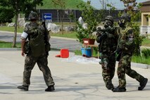 KUNSAN AIR BASE, Republic of Korea – Republic of Korea air force, 38th Fighter Group explosive ordinance disposal technicians, clear the ROKAF medical campus of airmen during exercise Beverly Midnight 13-3, Aug. 5, 2013. The exercise allowed U.S. and ROK airmen to test their ability to take the fight North. (U.S. Air Force photo by Staff Sgt. Tong Duong/Released)