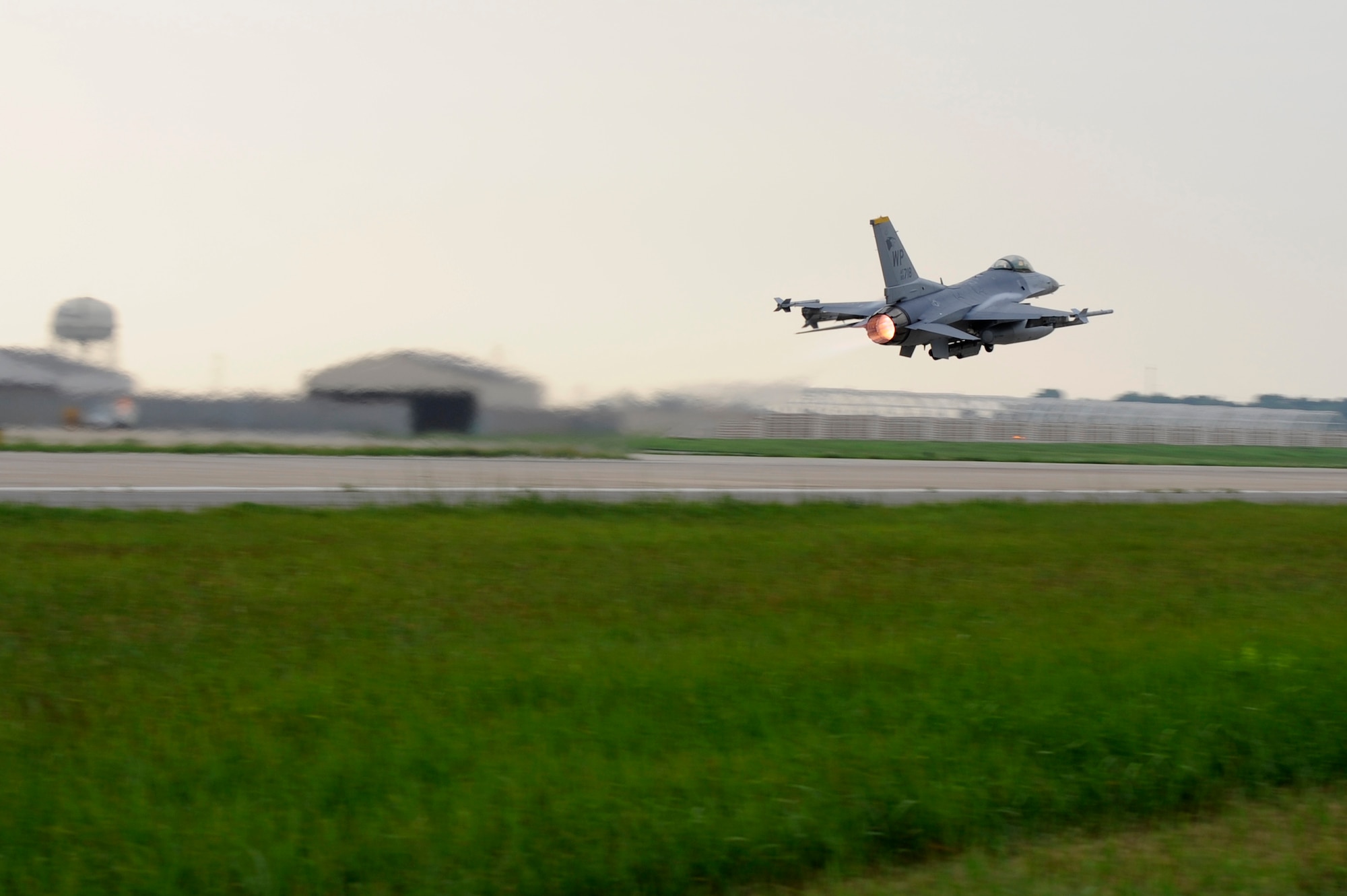 KUNSAN AIR BASE, Republic of Korea – An F-16 Fighting Falcon from the 80th Fighter Squadron, takes to the sky during the early morning hours of exercise Beverly Midnight 13-3, Aug. 6, 2013. The exercise demonstrated the Wolf Pack’s ability to take the fight North. (U.S. Air Force Photo by Staff Sgt. Tong Duong/Released)