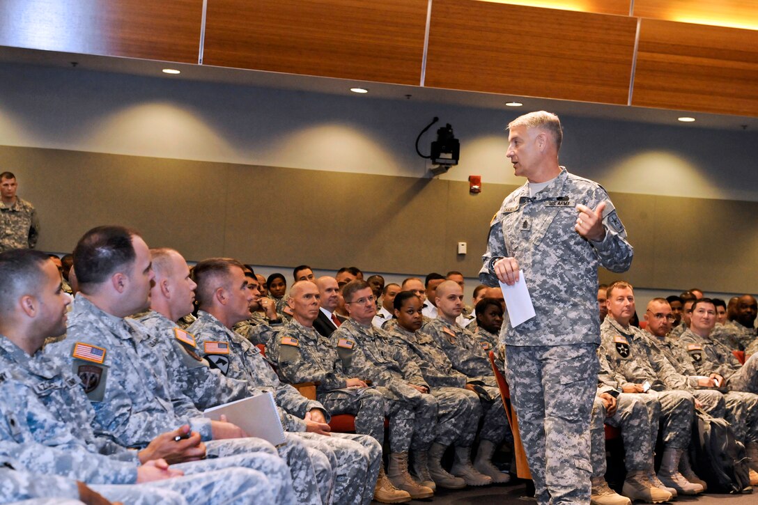 Sgt. Maj. of the Army Raymond F. Chandler III talks to soldiers during a town hall meeting at the Pentagon, Aug. 5, 2013.