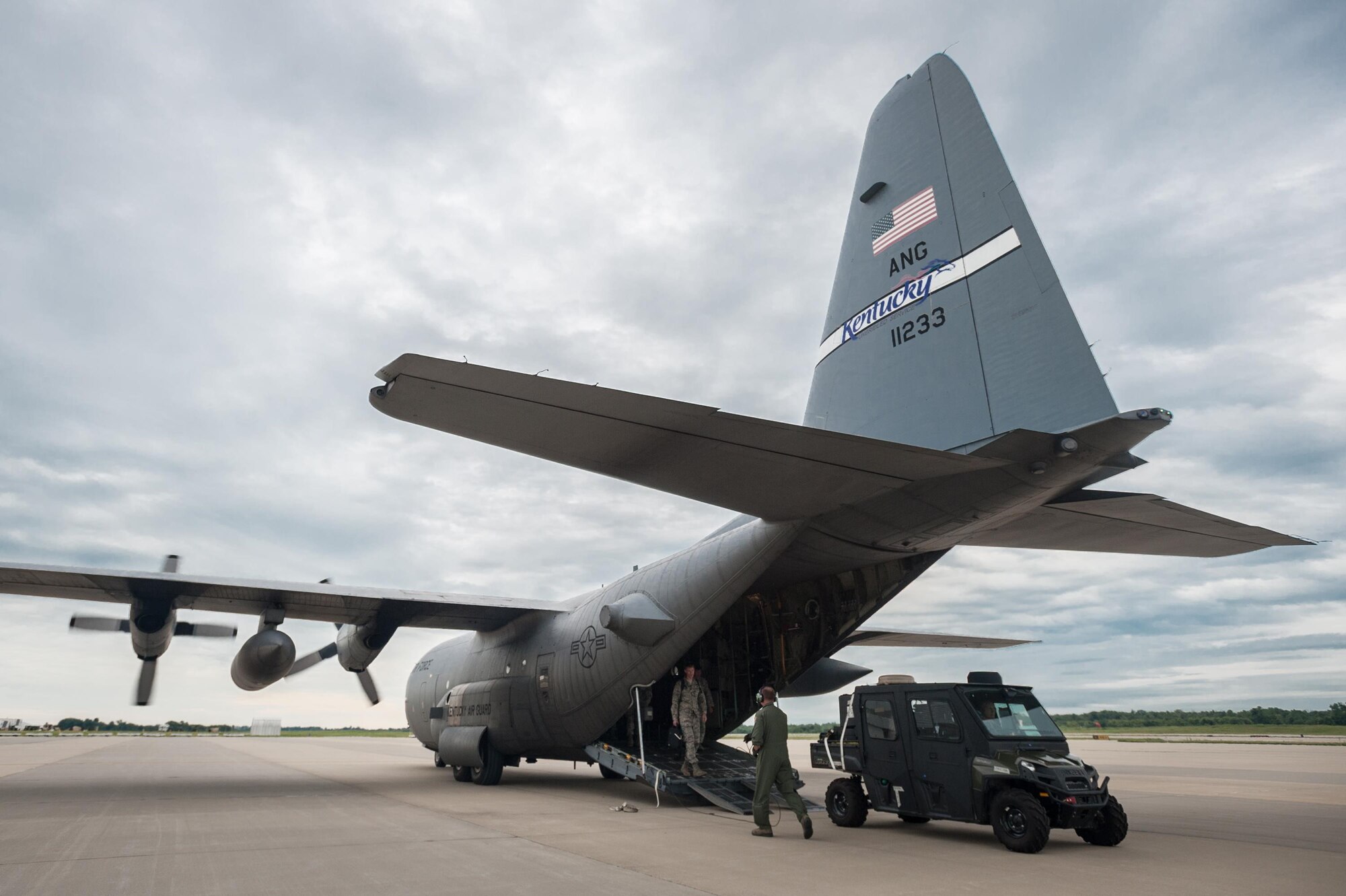 Members of the Kentucky Air National Guard’s 123rd Contingency Response Group offload an all-terrain vehicle at MidAmerica St. Louis Airport in Mascoutah, Ill., on Aug. 5, 2013, as part of Exercise Gateway Relief, a U.S. Transportation Command-directed earthquake-response scenario. The vehicle, which serves as a mobile command post, is equipped with satellite communications gear that allows a Joint Assessment Team to establish secure voice and data communications with USTRANSCOM officials upon landing at a non-functional airfield, reporting the status of facilities and the ability to support relief operations. 