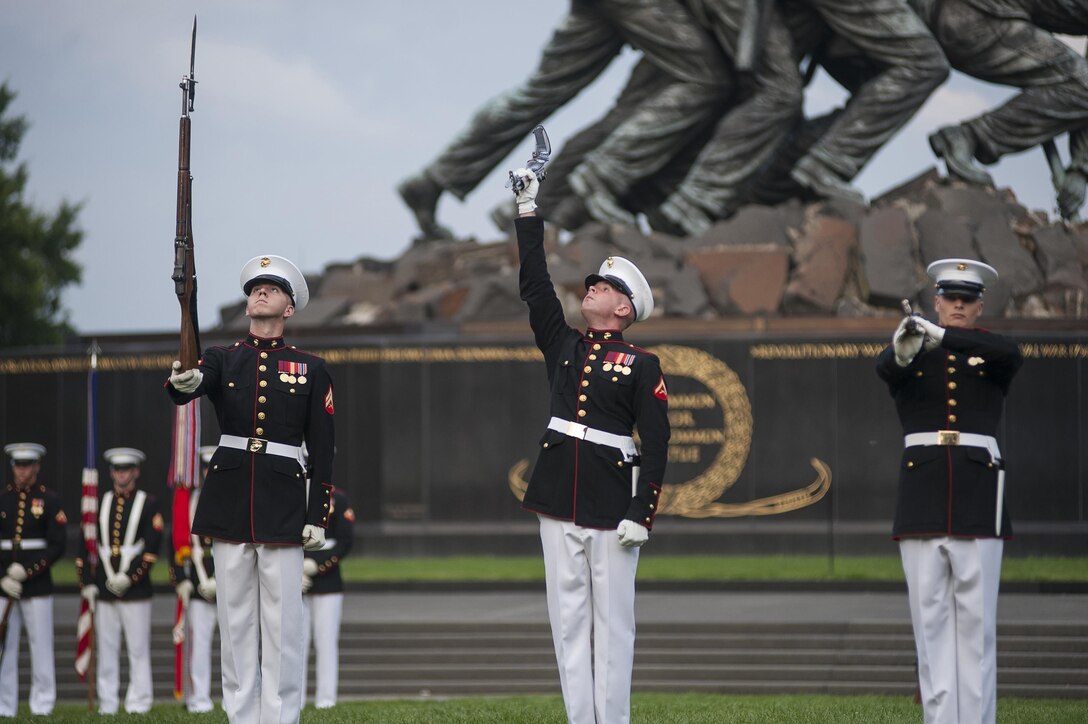 Cpl. Miles Manchester, Marine Corps Silent Drill Platoon member, performs during a Tuesday Sunset Parade at the Marine Corps War Memorial in Arlington, Va., Aug. 6. Kenichiro Sasae, ambassador of Japan to the United States, was the parade’s guest of honor. The U.S. considers Japan one of its closest allies and partners, and both share a firm and active political relationship.
