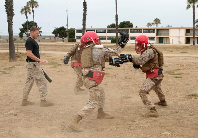 MARINE CORPS BASE CAMP PENDLETON, Calif. – Students attending the Martial Arts Instructor Course spar using training weapons here, July 30, 2013. The Marine Corps Martial Arts Program instructs Marines on the use of many types of close combat weapons, including knives, bayonets, and weapons of opportunity.
(U.S. Marine Corps photo by Sgt. Jacob H. Harrer)