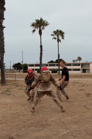 MARINE CORPS BASE CAMP PENDLETON, Calif. – Sergeant Carlos Camachorojas, parachute rigger and delivery specialist, 1st Reconnaissance Battalion, attacks his opponent using a wooden bayonet trainer during the Martial Arts Instructor Course here, July 30, 2013. Camachorojas, a native of Mesa, Ariz., said he was well prepared for the physical demands of the course, but his greatest challenge was learning the academic materials.
(U.S. Marine Corps photo by Sgt. Jacob H. Harrer)