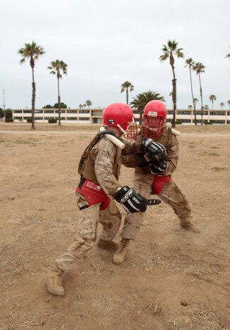 MARINE CORPS BASE CAMP PENDLETON, Calif. – Corporal Matthew J. Scheffers, left, combat engineer, 1st Combat Engineer Battalion, spars with an opponent with training knives during the Martial Arts Instructor Course at Edson Range here, July 30, 2013. Scheffers, a native of Kalamazoo, Mich., recently completed the three-week course, receiving instruction on close combat, combat fitness, nutrition, instructional techniques, continuum of force and other subjects.
(U.S. Marine Corps photo by Sgt. Jacob H. Harrer)