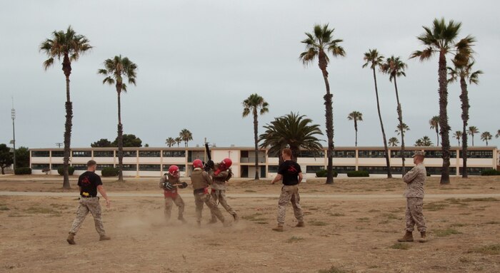 MARINE CORPS BASE CAMP PENDLETON, Calif. – Students of the Martial Arts Instructor Course spar with training weapons at Edson Range here, July 30, 2013. The Marine Corps Martial Arts Program teaches Marines not only how to use violence, but how to make ethical decision in their everyday lives. It aims to develop ethical warriors through three core disciplines: physical, mental and character.
(U.S. Marine Corps photo by Sgt. Jacob H. Harrer)