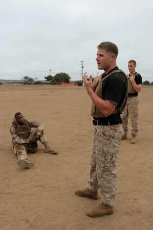 MARINE CORPS BASE CAMP PENDLETON, Calif. – Sergeant Erik A. Christianson, martial arts instructor trainer, Weapons Field Training Battalion, teaches his Marines the importance of breaking down mental barriers after a combat conditioning exercise as part of the Martial Arts Instructor Course at Edson Range here, July 30, 2013. Christianson, a native of La Crosse, Wisc., said the body is much more capable than people realize, and he pushed his Marines past their limits to help them develop mental toughness.
(U.S. Marine Corps photo by Sgt. Jacob H. Harrer)