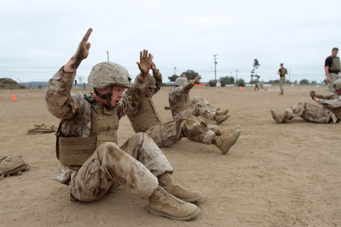 MARINE CORPS BASE CAMP PENDLETON, Calif. – Corporal William S. Hall, combat engineer, 1st Combat Engineer Battalion, performs a situp during a combat conditioning exercise as part of the Martial Arts Instructor Course here, July 30, 2013. Hall, a native of Paducah, Ky., completed situps, pushups, and burpees with teammates while an individual Marine crawled and jumped around a circuit course. Teammates relied on each other to quickly complete the circuit course and progress through the exercise.
(U.S. Marine Corps photo by Sgt. Jacob H. Harrer)