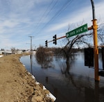 A look out over the flooded streets one block from the Fargo City Hall from the top of a dike where Soldiers of the 153 rd Engineer Battalion out of Huron went on a recon this afternoon to become familiar with the dikes they are assigned to patrol during their 12 hour shift to report leaks or breaches to the North Dakota joint operations center.