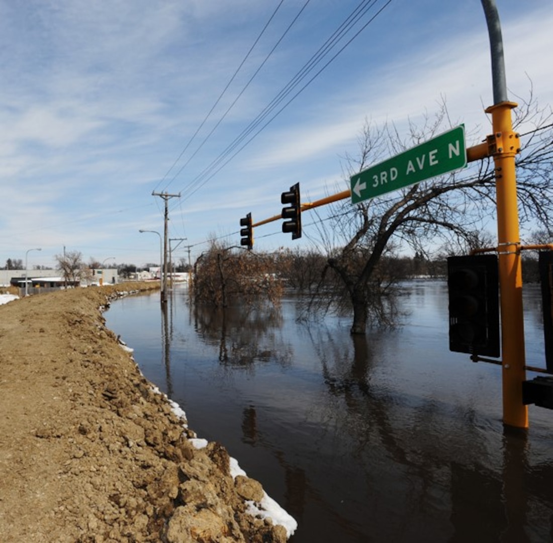 A look out over the flooded streets one block from the Fargo City Hall from the top of a dike where Soldiers of the 153 rd Engineer Battalion out of Huron went on a recon this afternoon to become familiar with the dikes they are assigned to patrol during their 12 hour shift to report leaks or breaches to the North Dakota joint operations center.